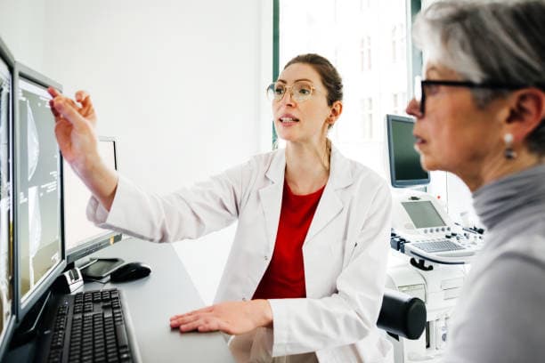 Doctor reviewing health data with patient